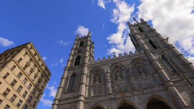 Place d'Armes square and Notre-Dame Basilica in Old Montreal historic town near Old Port