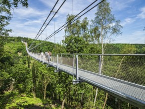 Rappbode water reservoir, people walk on suspension bridge Titan RT, Rappbode, Harz, Germany,