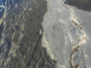 Aerial view, glaicial streams flow across Mælifellssandur, black sand desert, Icelandic highlands,