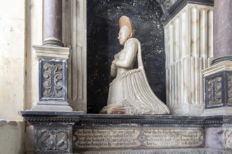 Woman kneeling family memorial monument, Kedington church, Suffolk, England, UK, Grissell