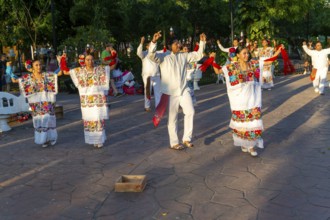 Folk dancers with bottles balanced on their heads, Francisco Cantón Rosado Park, Valladolid,