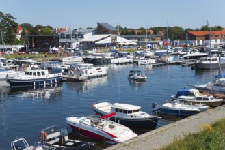 A lively marina with many boats and surrounding houses, Gizycko, Warminsko-Mazurskie,