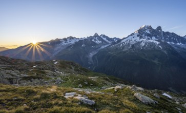 Morning atmosphere with sun star, mountain landscape at sunrise, mountain peak, Aiguille Verte,