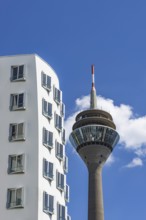 Gehry buildings and Rhine Tower, Media Harbour, Neuer Zollhof, Düsseldorf, North Rhine-Westphalia,