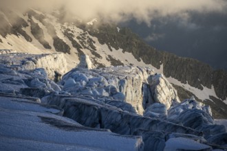 Glacier ice with crevasses in the evening light, Glacier du Tour at sunset, High alpine mountain