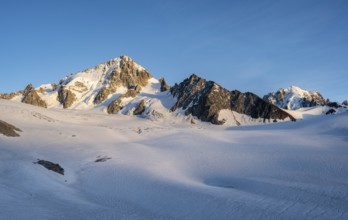 High alpine mountain landscape at sunset, summit of Aiguille de Chardonnet and Aiguille Verte,