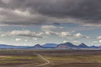 Barren volcanic landscape, gravel road, clouds, summer, Mödrudalur, North Iceland, Iceland, Europe