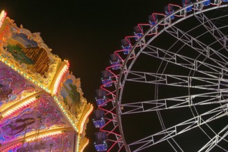 A funfair at night with illuminated chain carousel and Ferris wheel, Europa Rad, rides, wave