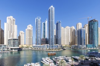 Dubai Marina skyline skyscrapers with yachts skyscrapers living on the waterfront in Dubai, United