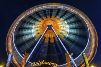 Illuminated Ferris wheel in motion, night shot, Oktoberfest, Festwiese, Theresienwiese, Munich,