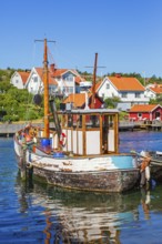 Old fishing boat at a jetty in a fishing village on the Swedish west coast, Hamburgsund, Bohuslän,