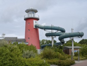 Lighthouse slide, Ocean wave adventure pool, Norddeich, East Frisia, Lower Saxony, Germany, Europe