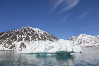 Iceberg melting in summer in Magdalenefjorden, fjord in Albert I Land on Svalbard, Spitsbergen,