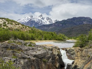 View over river Rio Tranquilo to mountain range of San Lorenzo, on road X-901 leading to Calluqueo