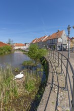 Old town of Nyborg, moat around the medieval town, restored, historic houses, bright colours, reed