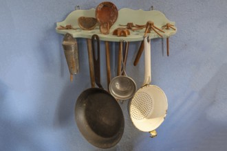 Kitchen utensils hanging on a board in the kitchen around 1900, Häckerhaus built in 1793, today