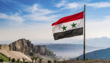 The flag of Syria flutters in the wind