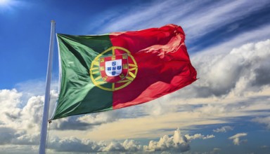 Flags, the national flag of Portugal flutters in the wind