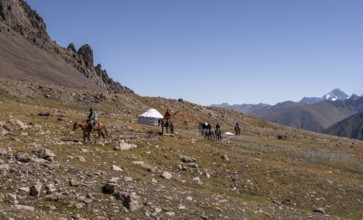 Hikers and yurts in the high valley, Keldike Valley on the way to the Ala Kul Pass, Tien Shan