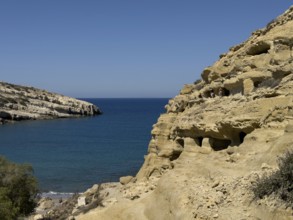 View of entrances of caves in sandstone rocks of former Roman necropolis with sandstone caves