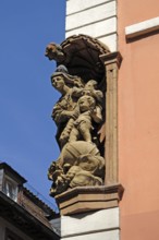 Figures of saints (Mary with Christ Child) with canopy integrated in a corner house, Hauptstr. 137,