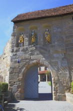 Entrance gate with Gothic wooden sculptures, St Sebastian, St George and St Laurentinus, fortified