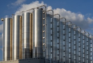 Stainless steel tanks of a large silo facility in Duisburg inland harbour, Duisburg-Neuenkamp, for