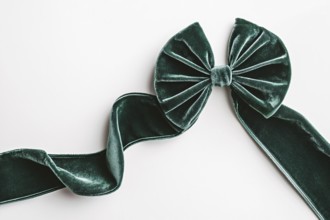 Beautiful green velvet ribbon on white background. Generative AI, AI generated