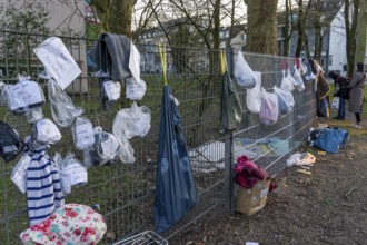 Gift fence with donations for the homeless and needy, food, hygiene articles, clothing, in Essen