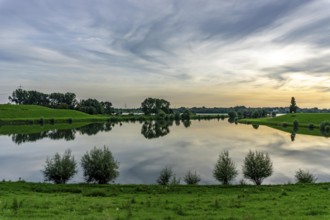 Lower Rhine landscape, reflection in the turning basin of the northern harbour of Walsum, view to