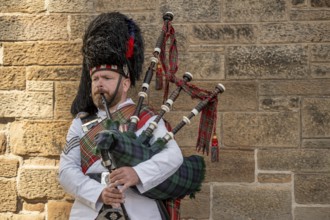 Piper, bagpiper, bagpipe player, bagpipes, bearskin hat, world's largest cultural festival The