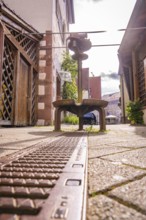 View of a historic alley with cobblestones and old buildings in a town, Nagold, Black Forest,