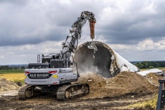 Demolished tower of a 20 year old wind turbine, in the Werl wind farm, 5 old Enercon E-66 turbines