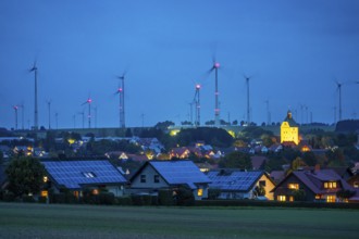 Wind farm above the village of Lichtenau, self-proclaimed energy town, houses with photovoltaic