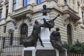 Bucharest, in the centre, monument of Eugeniu Carada near the building of the National Bank, Eugen