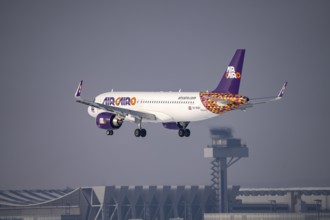 Air Cairo Airbus A320neo approaching Frankfurt FRA airport, air traffic control tower, Fraport, in