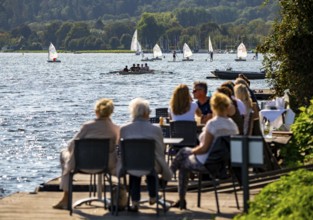 Lake Baldeney in Essen, Ruhr reservoir, sailing boats, café terrace on the shore, Essen, North