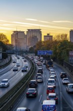 Evening traffic, partly with traffic jams, slow-moving traffic on the A40 motorway, Essen skyline,