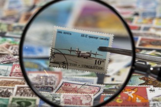 Stamp collection, collecting, postage stamps, postage stamps from different countries, magnifying