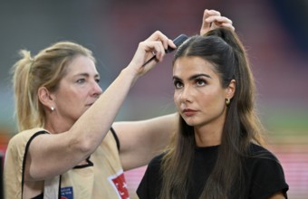 Make-up artist fixes the hair of TV presenter Lea Wagner, portrait, Voith Arena, Heidenheim,