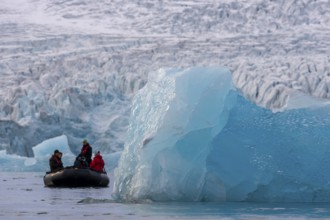 Dinghy with tourists in front of the glacier edge of Monacobreen, iceberg, Liefdefjord, Woodfjord