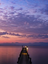 Footbridge on Lake Chiemsee at dawn, with the Chiemgau Alps behind, Chiemgau, Upper Bavaria,