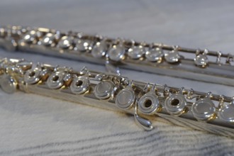 Close-up of the keys of a silver flute