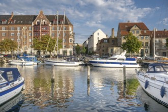 Sailboats and historic buildings, Christianshavn Canal, Copenhagen, Denmark, Europe