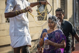 Pilgrims at a washing ritual with 22 stations around the Ramanathaswami temple, a ceremony in which