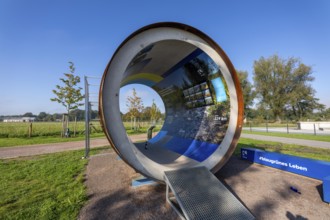 Original sewer pipe element of the Emscher sewer as an information stand in Emscherland, a new