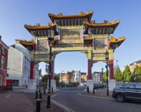 Impressive traditional Chinese Tor tor under clear skies and empty streets, Liverpool