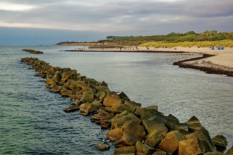 Baltic Sea beach, walkers on the Baltic Sea coast on Wustrow beach in the evening light, evening