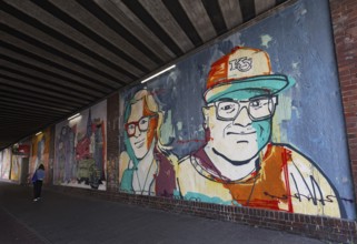 Mural with portraits of two real people in a subway, urban art in the Oberbilk district,