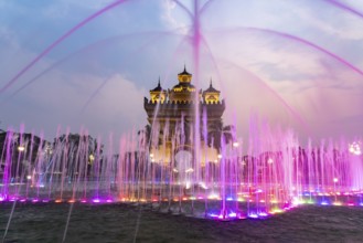 Colourfully illuminated fountain at Patuxai Victory Gate at dusk, capital Vientiane, Laos, Asia